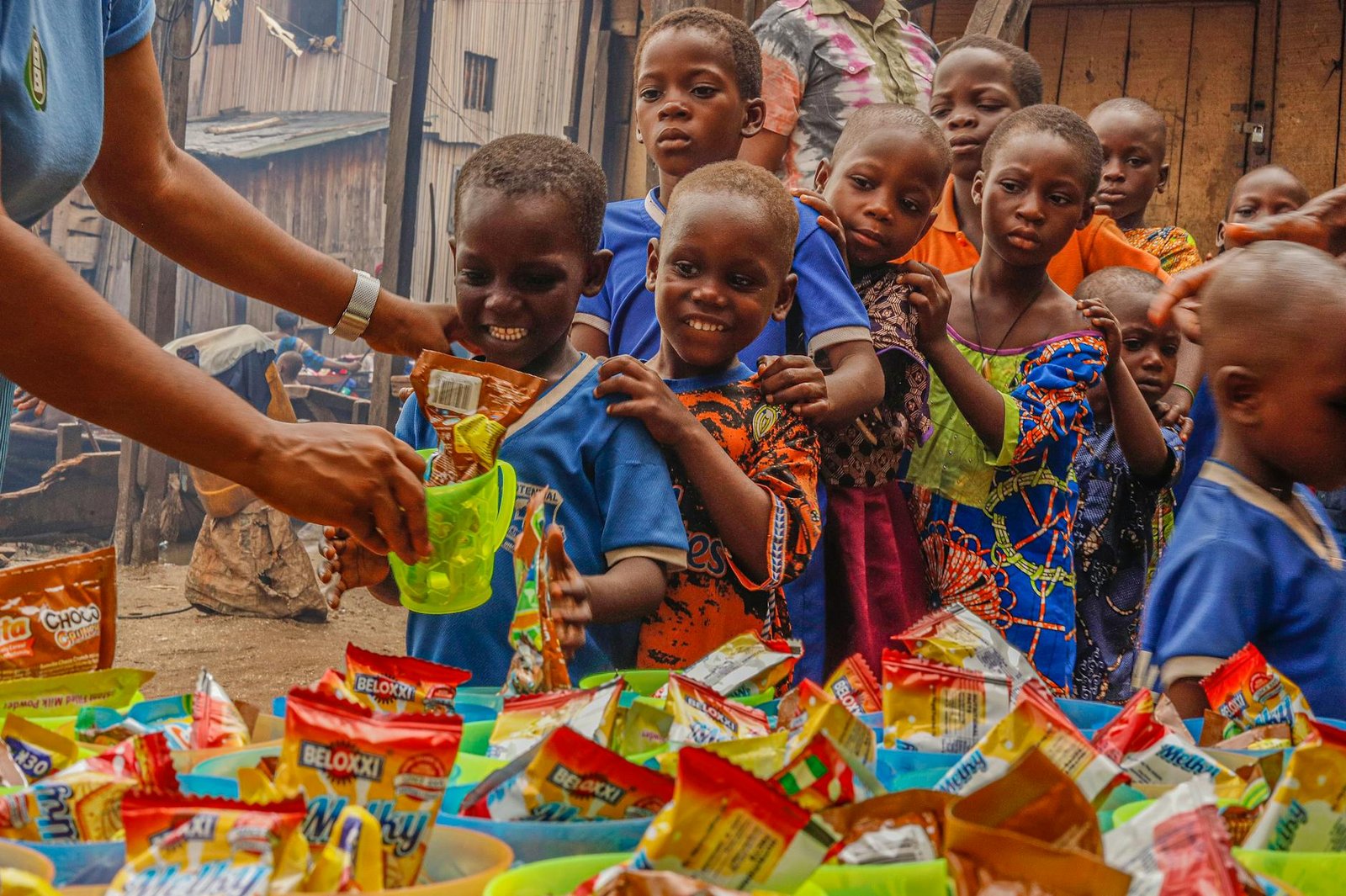 Volunteers helping children